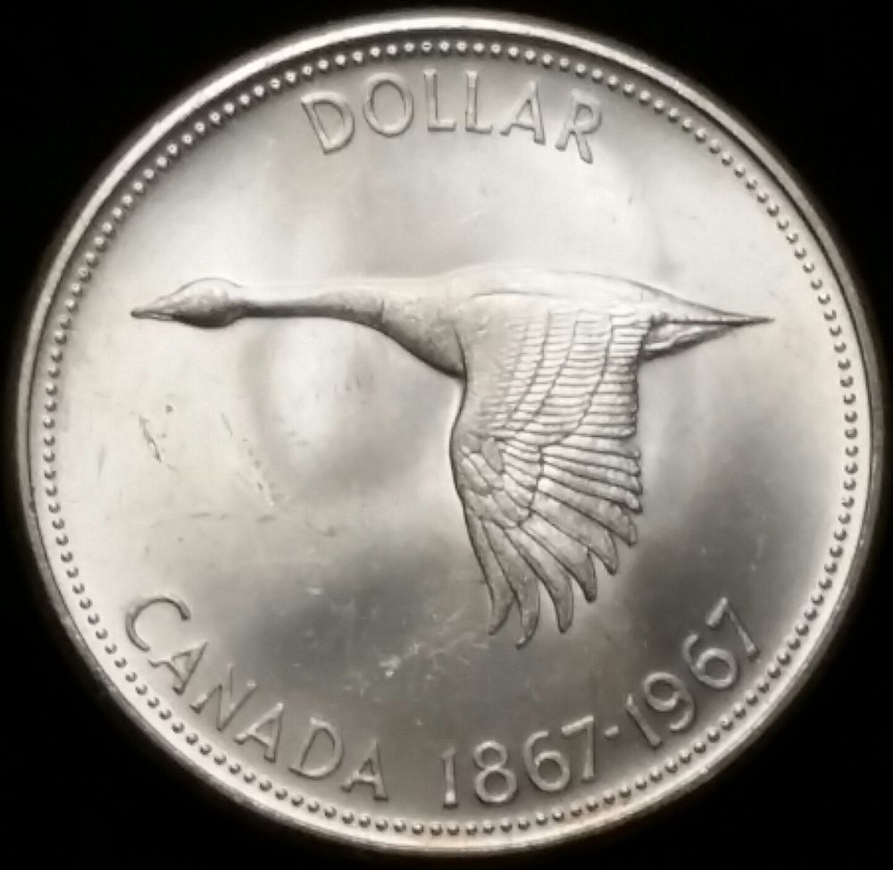 1967-Canadian-Dollar-Off-Center-Strike-Or-Soft-Struck-Edge?